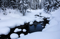 Snowy pillows along the stream
