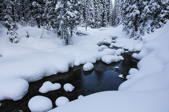 Snowy pillows along the stream